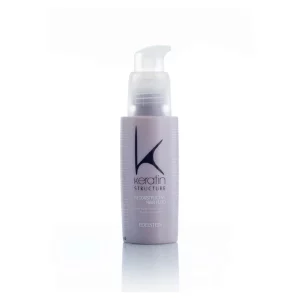 Keratin Structure Fluid, ein Haarpflegeprodukt, das enthält eine konzentrierte Formel mit Keratin und anderen nährenden Inhaltsstoffen, die darauf abzielen, das Haar zu stärken, zu reparieren und ihm Feuchtigkeit zu spenden.